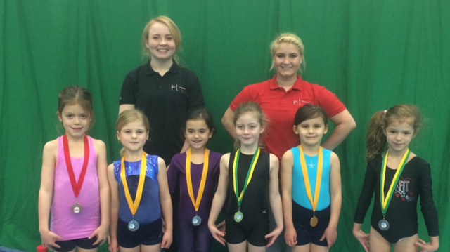 Georgie, Katie and their medal winning gymnasts